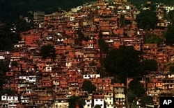 FILE - Houses clutter a hillside in one of the many "favelas," or impoverished neighborhoods, in Rio de Janeiro, Brazil, June 23, 1999.