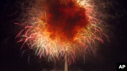 In this July 4, 2018, file photo, fireworks explode over Lincoln Memorial, Washington Monument and U.S. Capitol, along the National Mall in Washington, during the Fourth of July celebration.