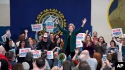 Sen. Elizabeth Warren reacts as she takes the stage during a campaign stop in Manchester, N.H., Nov. 23, 2019.