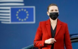 FILE - Danish Prime Minister Mette Frederiksen arrives for an EU summit in Brussels, Oct. 22, 2021.