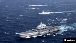 China's Liaoning aircraft carrier with accompanying fleet conducts a drill in an area of South China Sea, in this undated photo taken December 2016. 