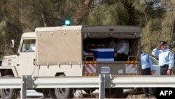 The convoy with the body of former Israeli prime minister Ariel Sharon's arrives at the grave site where his second wife Lily is buried, on Jan. 13, 2014 at the family ranch Havat Shikmin, near the Israeli city of Sderot in the southern Negev desert. 