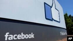 This file photo shows a sign at Facebook headquarters in Menlo Park, Calif. Facebook says hackers accessed data from 29 million accounts as part of the security breach disclosed two weeks ago.