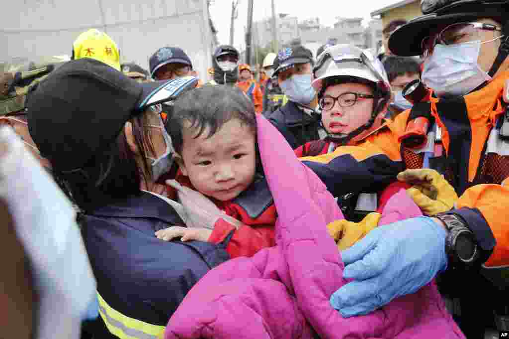 A baby boy is rescued from a collapsed building after an earthquake in Tainan, Taiwan, Feb. 6, 2016. 