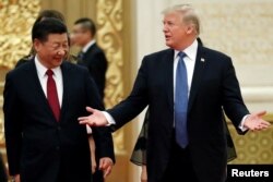 U.S. President Donald Trump and China's President Xi Jinping arrive for a state dinner at the Great Hall of the People in Beijing, Nov. 9, 2017.