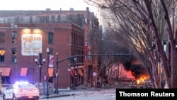 Debris litters the road near the site of an explosion in the area of Second and Commerce in Nashville