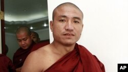 Shin Gambira, 32, a monk who helped lead protests, detained and recently released, attends a ceremony of 'Pray for Peace and Religious Unity' at a church in Yangon, Burma, January 16, 2012.