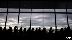 Filipina workers returning home from Kuwait arrive at Manila International Airport on February 18, 2018.