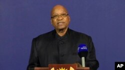 In this image from TV, President of South Africa Jacob Zuma announces the death of former South African President Nelson Mandela, to the media, Dec. 5, 2013, from a podium in Pretoria, South Africa.