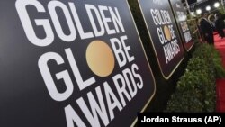 FILE - Signage promoting the 77th annual Golden Globe Awards and NBC appears in Beverly Hills, Calif. on Jan. 5, 2020. NBC said Monday that will not air the Golden Globes in 2022. (Photo by Jordan Strauss/Invision/AP, File)