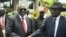 South Sudan's First Vice President Riek Machar, left, and President Salva Kiir shake hands following the first meeting of a new transitional coalition government, in the capital, Juba, April 29, 2016. 