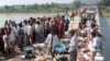Bodies are seen lying on a bridge following a stampede in Datia district, in India's Madhya Pradesh state, October 13, 2013.