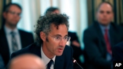 FILE - Alex Karp, chief executive officer of Palantir, speaks during an American Technology Council roundtable in the State Dinning Room of the White House, June 19, 2017, in Washington. 