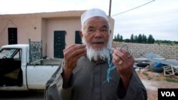 Mohamed talks about farming under the Gadhafi regime, April 9, 2012. (Stephanie Figgins)