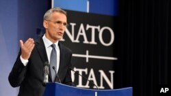 NATO Secretary General Jens Stoltenberg speaks during a media conference at NATO headquarters in Brussels on April 26, 2018.