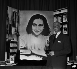 Dr. Otto Frank holds the Golden Pan award, given for the sale of 1 million copies of "The Diary of Anne Frank," June 14, 1971 in London. Dr. Frank was the only family member to survive World War II.