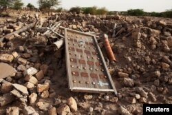 The rubble left from an ancient mausoleum destroyed by Islamist militants, is seen in Timbuktu, July 25, 2013.