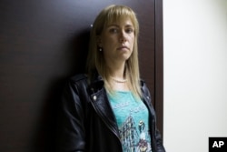 FILE - Opposition activist Maria Baronova, who ran for election in the 2016 Russian Parliamentary elections in Moscow, Russia, is shown Aug. 17, 2016.