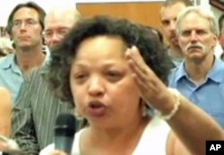 Community activist Vernice Miller-Travis raises concerns over development issues in the Chesapeake Bay watershed at a crowded town hall meeting in Annapolis, Maryland