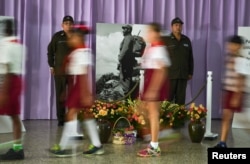 Students file past a tribute to Cuba's late President Fidel Castro in Santiago de Cuba, Cuba, Nov. 28, 2016.