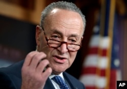 Senate Minority Leader Chuck Schumer, D-N.Y., holds a news conference to talk about the Democratic victory in the Alabama special election and to discuss the Republican tax bill, on Capitol Hill in Washington, Dec. 13, 2017.