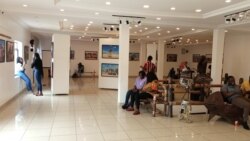 Visitors look at exhibits at the Thought Pyramid Art Center in Abuja, September 21, 2021. (Timothy Obiezu/VOA)