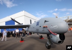 FILE - With the signature of the nation's founding father Kemal Ataturk on its front,Turkey's first drone airplane called Anka or Phoenix is seen during a roll out ceremony at the TAI - Turkish Aerospace Space Industries Inc., near Ankara, Turkey, July 16