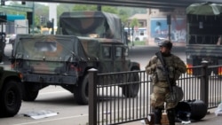 USA, Minneapolis, A National Guard member guards the area in the aftermath of a protest.