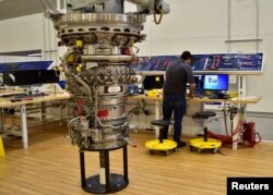 FILE - Technicians build LEAP engines for jetliners at a new, highly automated General Electric (GE) factory in Lafayette, Indiana, March 29, 2017.