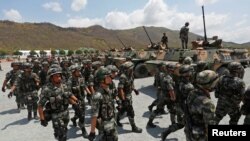 ទាហាន​ចិន​ចូលរួម​ក្នុង​ពិធី​បើក​ការ​ធ្វើ​សមយុទ្ធ​យោធា​រួម​គ្នា​ក្នុង​ខេត្ត​កំពង់ស្ពឺ កាល​ពី​ថ្ងៃ​ទី ១៧ ខែ មីនា ឆ្នាំ ២០១៨។