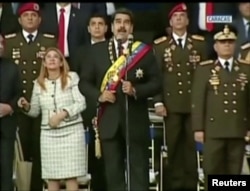Venezuelan President Nicolas Maduro reacts during an event that was interrupted, reportedly by explosives from drones, in this still frame taken from government video, Aug. 4, 2018, in Caracas, Venezuela.