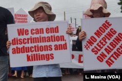 Children were also among the protesters. Some albino children have stopped going to school for fear of attacks.