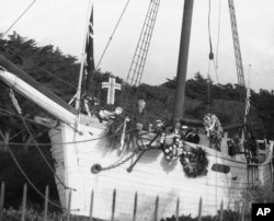 FILE - In this Dec. 14, 1928 file photo, O.T. Brandrud, Pastor of the Trinity Lutheran Church of Oakland, speaks during memorial services for explorer Roald Amundsen at the land anchorage of his former ship, the Gjoa, in Golden Gate Park, San Francisco. Amundsen sailed the Gjoa through the Northwest Passage in 1903, a voyage that took three years to accomplish.