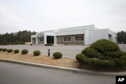 FILE - North Korea's Tongilgak building, the site for the high-level talks between two Koreas, is seen at the northern side of the Panmunjom in North Korea, March 29, 2018.