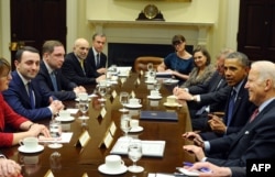 U.S. President Barack Obama and Vice President Joe Biden (R) meet with Prime Minister of Georgia Irakli Garibashvili (L) in the Roosevelt Room at the White House in Washington, D.C., Feb. 24, 2014.