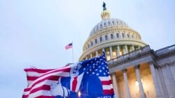 FILE - A flag depicting President Donald Trump flies on the East Front of the US Capitol on Jan. 6, 2021, in Washington.