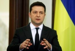 FILE - Ukrainian President Volodymyr Zelenskiy speaks during a joint statement with Croatian Prime Minister Andrej Plenkovic in Kyiv, Dec. 8, 2021.