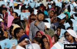 Believers attend a mass by Pope Francis in Dhaka, Bangladesh, Dec. 1, 2017.