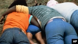 Unidentified members of the People/s Temple are pictured after they committed a mass suicide, led by cult leader Rev. Jim Jones in Jonestown, Guyana, 1978.