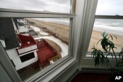 The view out the window of an oceanfront condo in Salisbury, Mass., Feb. 15, 2019. Academic researchers say concerns over rising sea levels and increased flooding have sapped more than $15 billion in appreciation from homes along the Eastern Seaboard and Gulf Coast.