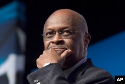 FILE - Herman Cain speaks during Faith and Freedom Coalition's Road to Majority event in Washington, June 20, 2014.