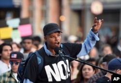 Xothitl Johnson addresses a crowd of protesters before a speech by Ben Shapiro on the campus of the University of California in Berkeley, Calif., Sept. 14, 2017. Several streets around campus were closed off Thursday with concrete and plastic barriers ahead of an evening appearance by the conservative commentator.