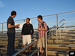 Steve Wilson visits with Martin Maldonado-Cortez and Miguel 'Angel' Arellano, two of the players he profiled in the book, 'The Boys From Little Mexico.'