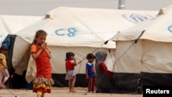 Displaced children, who fled from the Islamic State violence, gather at a refugee camp in the Makhmour area near Mosul, Iraq, June 17, 2016. Picture taken June, 17 2016.