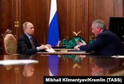 RUSSIA -- Russian President Vladimir Putin (L) and Roskosmos State Space Corporation Director General Dmitry Rogozin meet at the Kremlin in Moscow, February 4, 2019