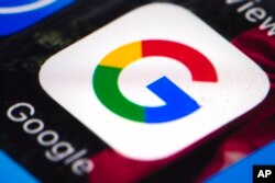FILE - A photo shows the Google mobile phone icon, in Philadelphia, April 26, 2017.