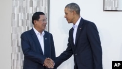 President Barack Obama greets Cambodia's Prime Minister Hun Senas, left, as he host a meeting of ASEAN, the 10-nation Association of Southeast Asian Nations, at the Annenberg Retreat at Sunnylands in Rancho Mirage, Calif., Monday, Feb. 15, 2016.