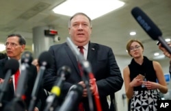 Secretary of State Mike Pompeo walks up to the microphones to speak to members of the media after leaving a closed door meeting about Saudi Arabia, Nov. 28, 2018, on Capitol Hill in Washington.