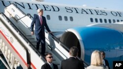 FILE - U.S. Secretary of State John Kerry arrives at Queen Alia Airport in Amman, Jordan, Sept. 10, 2014.
