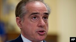 FILE - Secretary of Veterans Affairs David Shulkin addresses the House Veterans Affairs Committee's hearing on a community care program, on Capitol Hill in Washington, March 7, 2017.